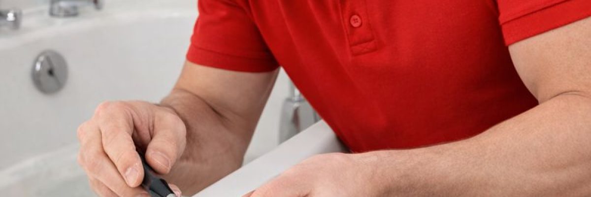 TECHNICIAN REPAIRING CHIPPED BATH